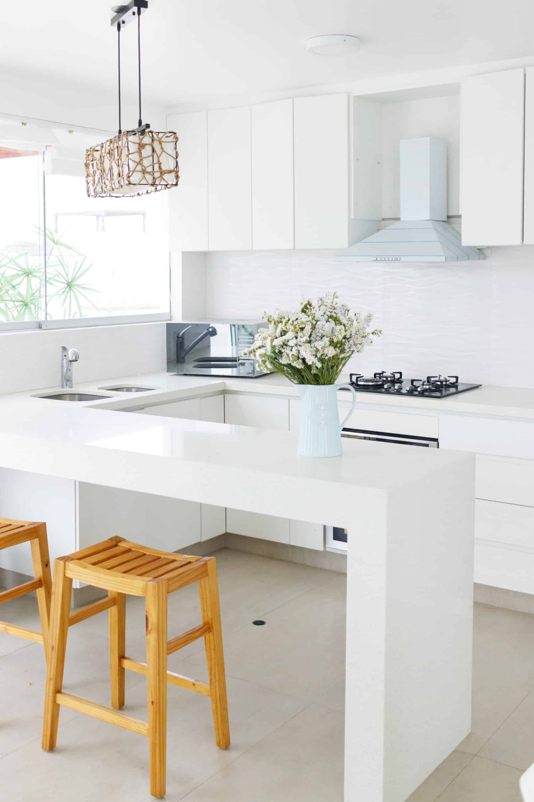 Cute flower arrangement in a home kitchen white kitchen island peninsula
