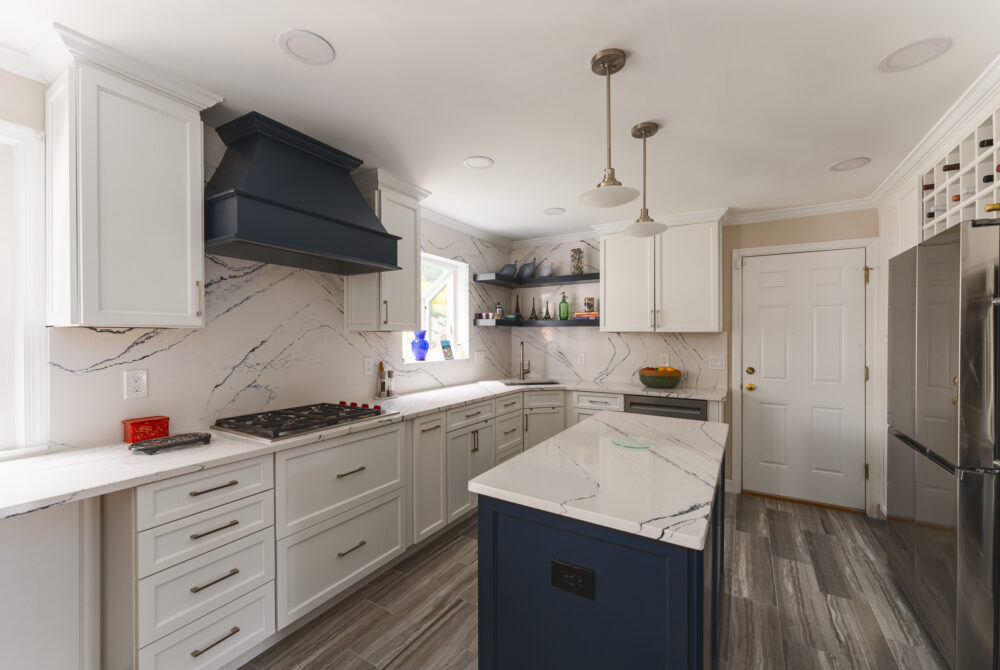 Modern Loudoun County kitchen remodel with open shelving, white cabinets, quartz countertops, and a small kitchen island