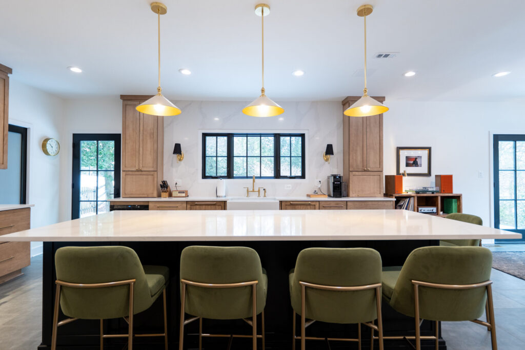 Bright kitchen with large windows overlooking the backyard